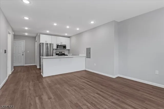 a view of kitchen with wooden floor