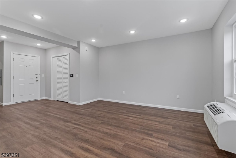 224 Broad Street Bloomfield, NJ 07003 - Photo 5 of 45 a view of an empty room with wooden floor