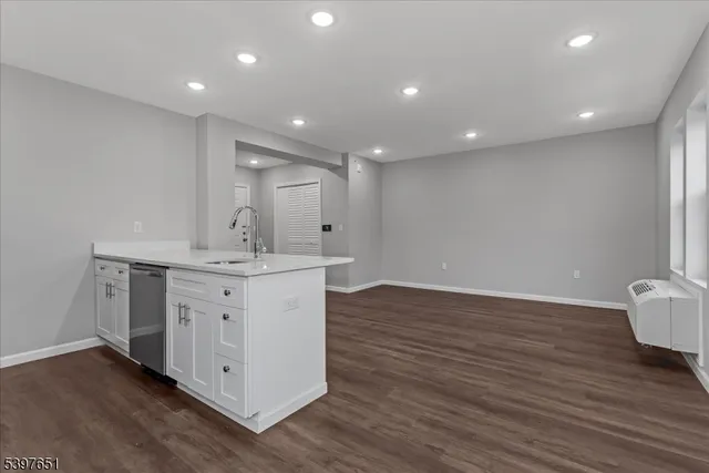 a view of kitchen with wooden floor and window