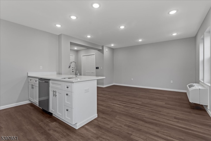 224 Broad Street Bloomfield, NJ 07003 - Photo 9 of 45 a view of kitchen with wooden floor and window