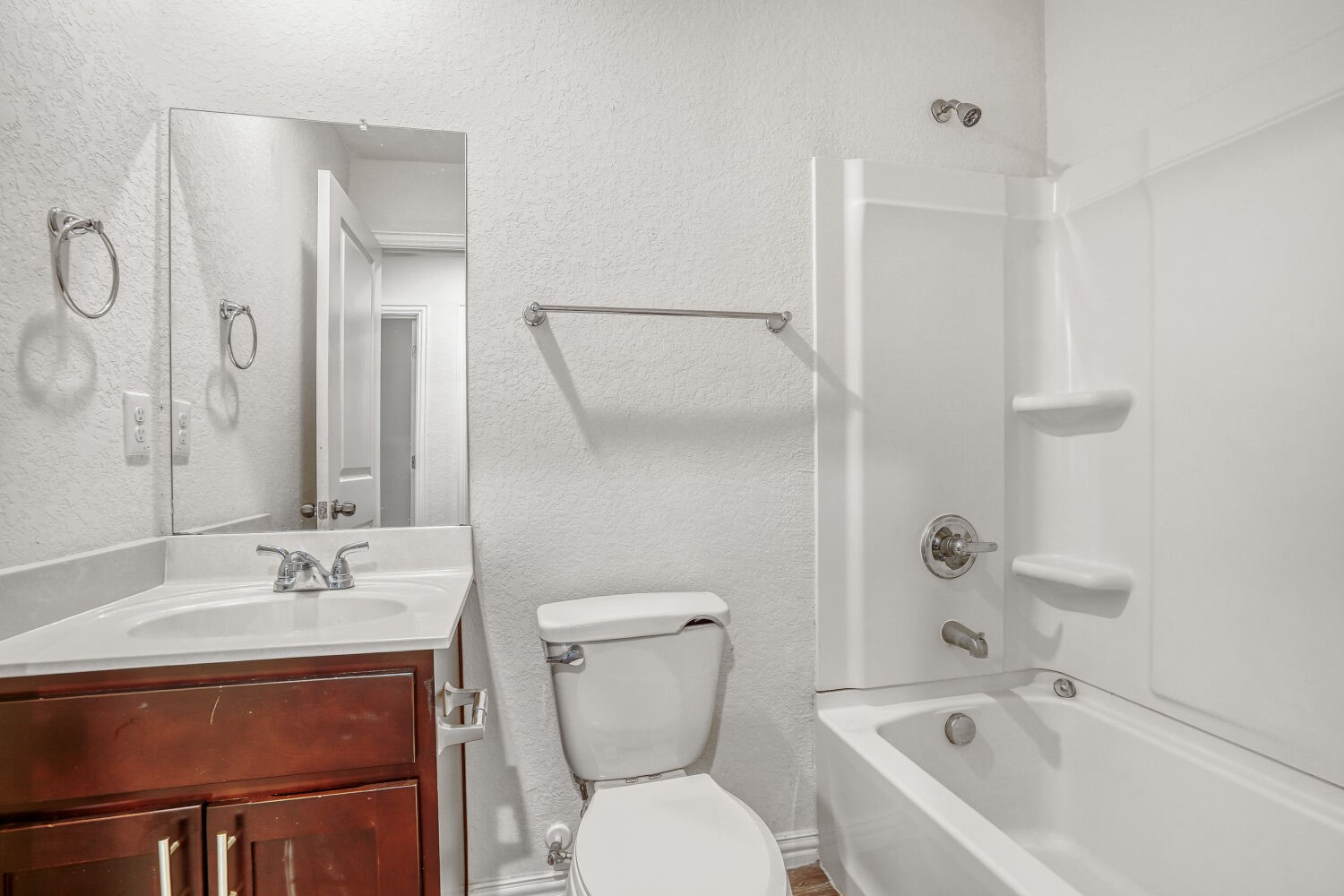 5626 Simsdale Street Houston, TX 77033 - Photo 9 of 10 a bathroom with a sink toilet and shower