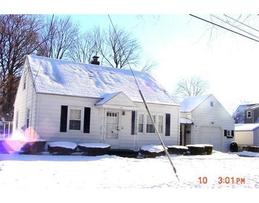 a view of a white house with a yard