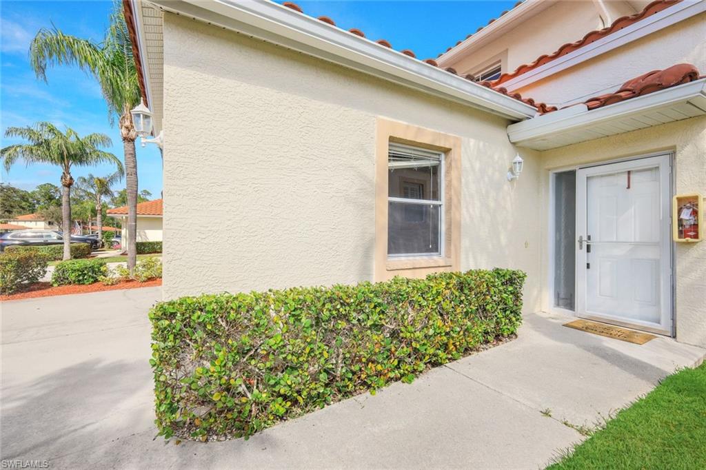 650 Luisa Lane, Unit 4 Naples, FL 34104 - Photo 2 of 19 a view of a backyard of a house