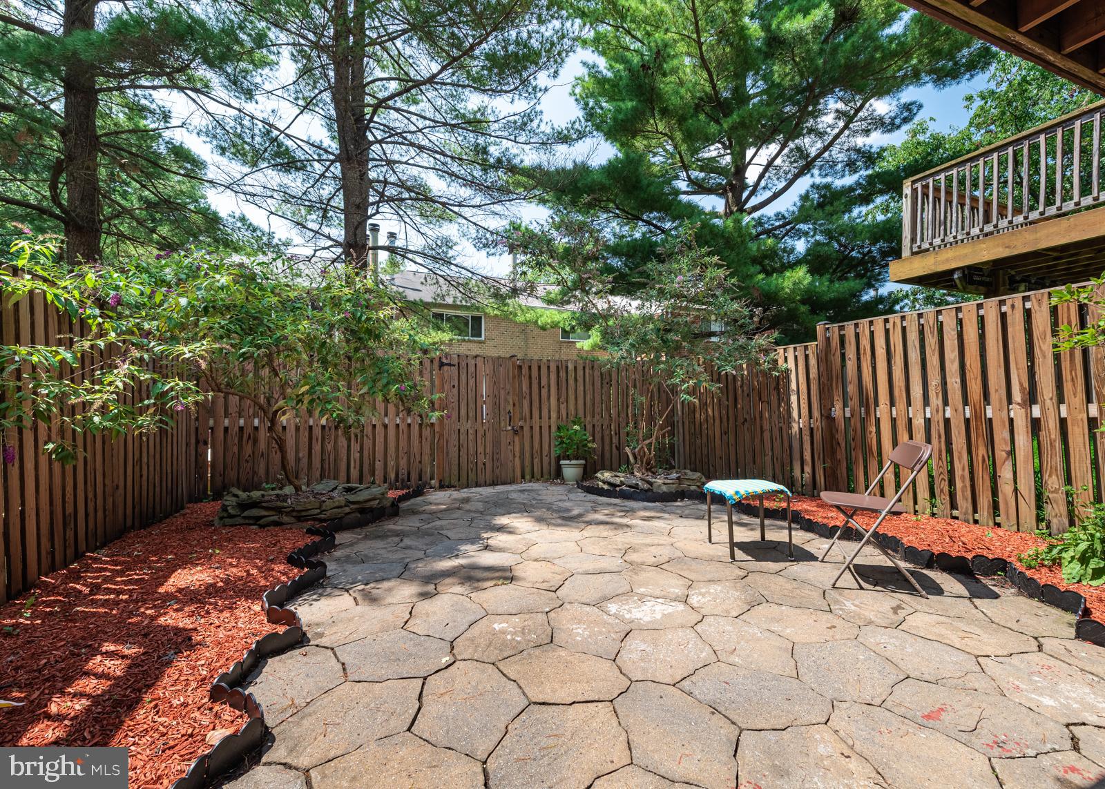 10544 East Wind Way Columbia, MD 21044 - Photo 25 of 42 a view of backyard with wooden fence and a large tree