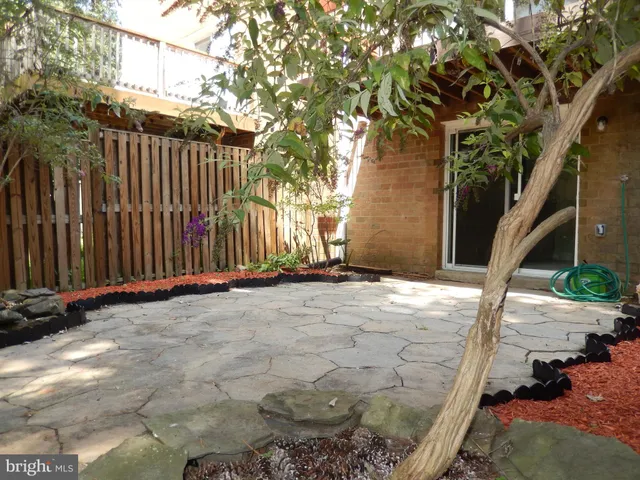 a view of a backyard of the house