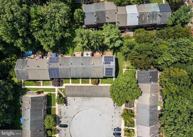 an aerial view of residential houses with outdoor space