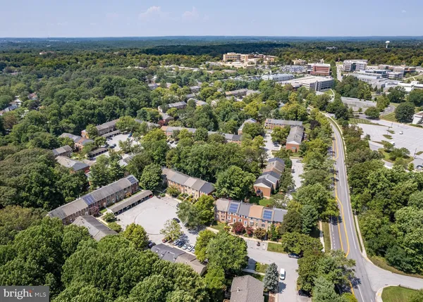 an aerial view of residential building and green space
