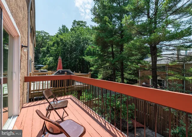 a view of a two chairs in the balcony