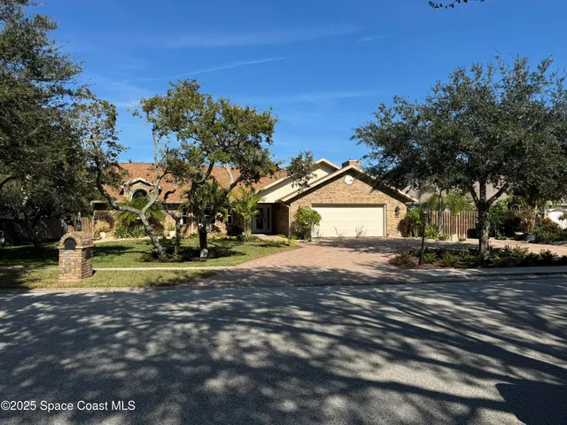 a view of a yard with wooden fence