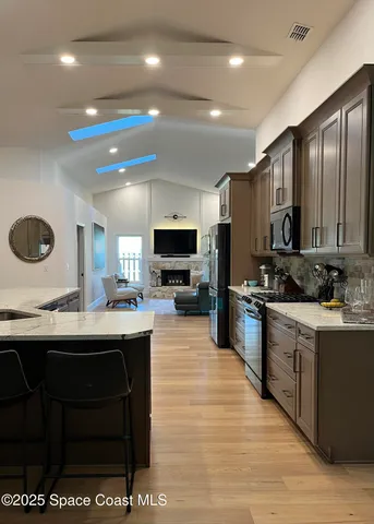 a kitchen with a refrigerator a sink and dishwasher