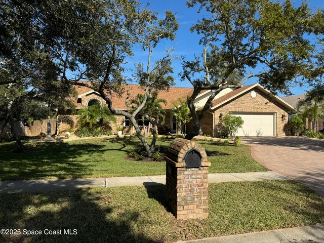 a view of a park with large trees