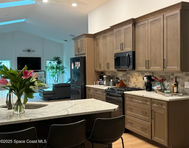 a view of a livingroom with furniture and window