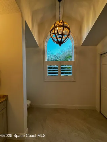 a spacious bathroom with a sink a mirror and a vanity