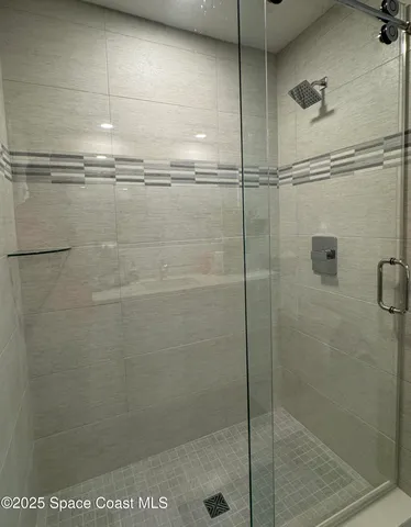 a view of a swimming pool with chair and tables