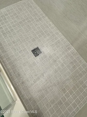 a view of backyard with outdoor seating and plants