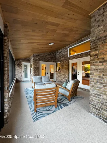 a view of a glass door and a window