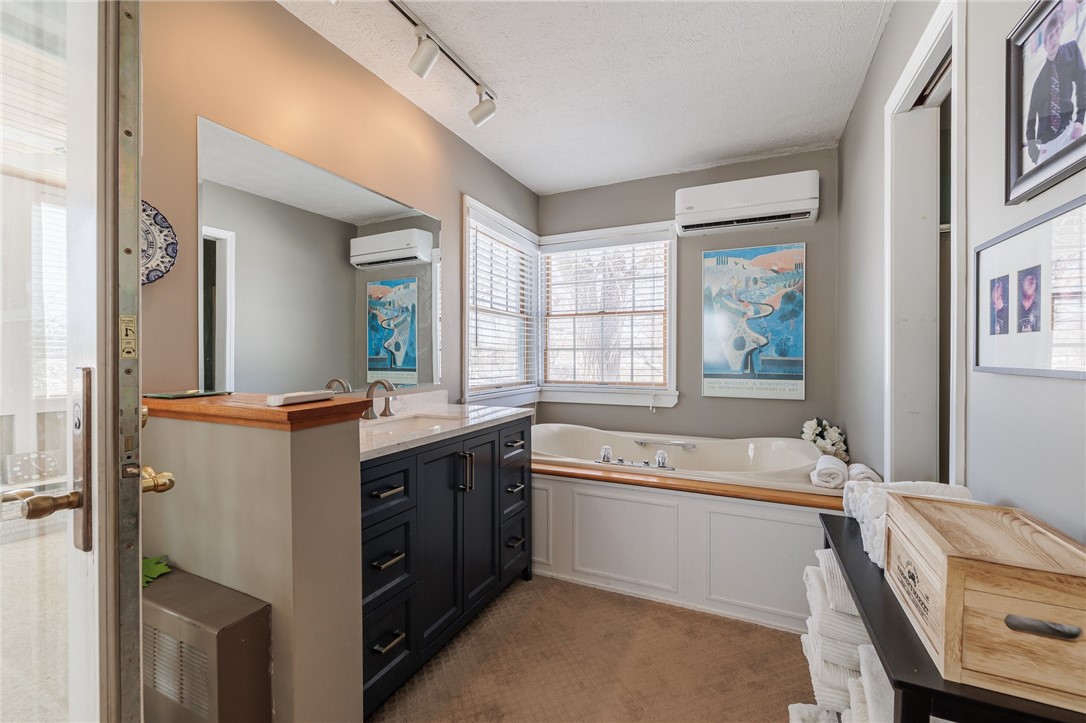 2273 Edgemere Drive Greece, NY 14612 - Photo 18 of 50 Primary bathroom. Soaking tub, sink, stand up show