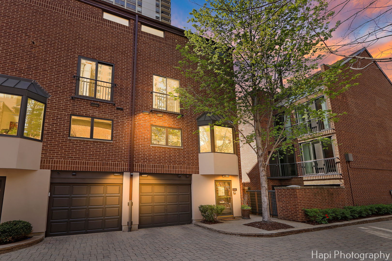 1340 North Sutton Place Chicago, IL 60610 - Photo 1 of 40 a front view of a house with a yard