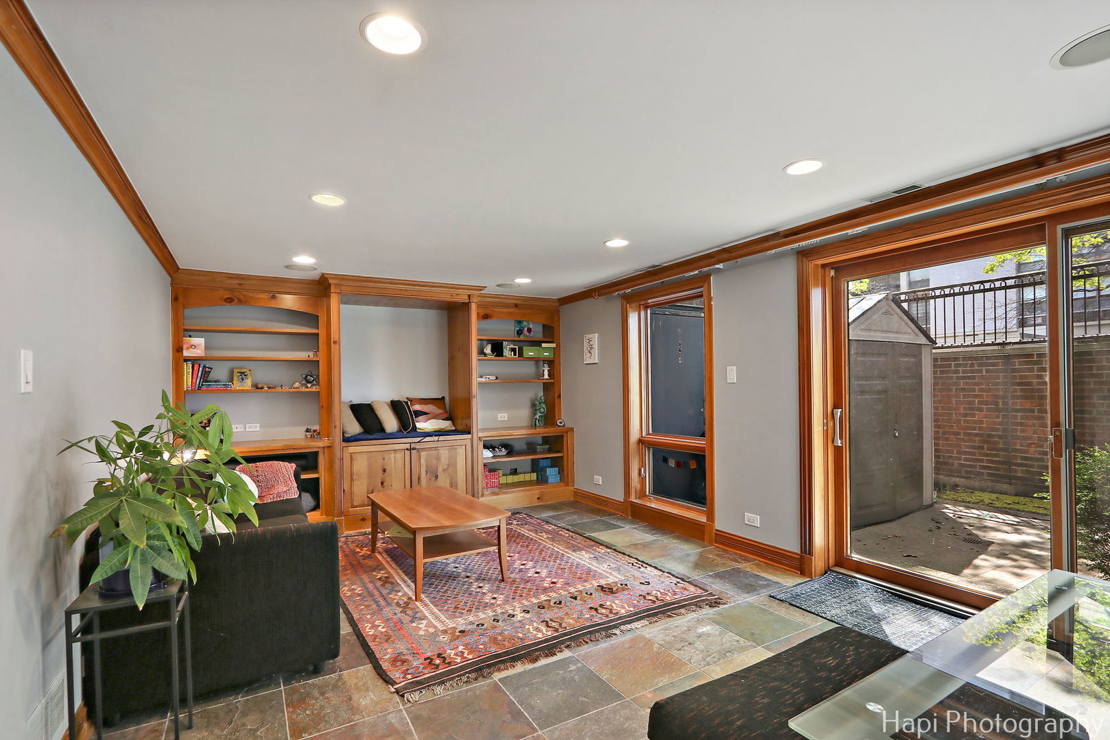 1340 North Sutton Place Chicago, IL 60610 - Photo 22 of 40 a living room with furniture and a potted plant