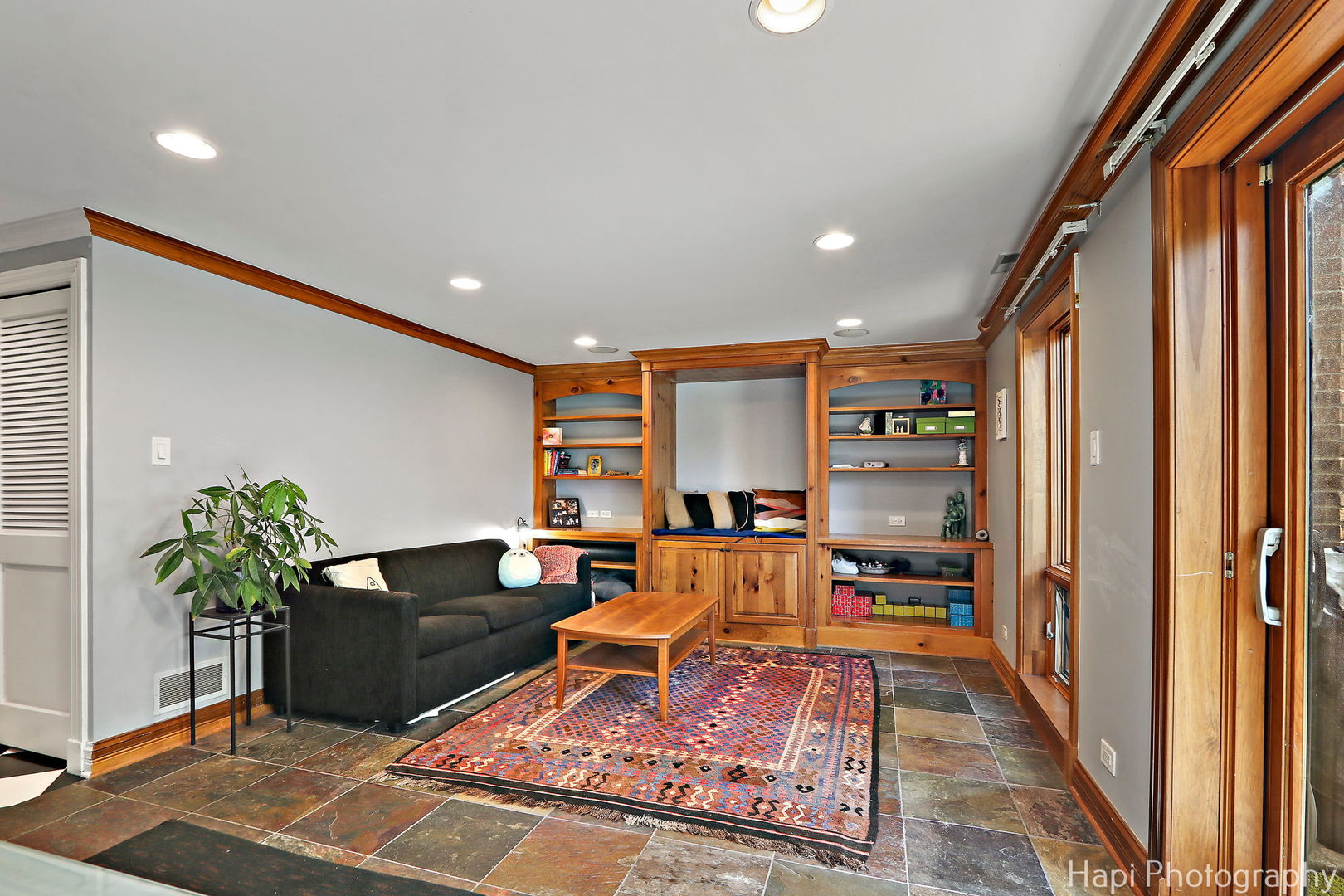 1340 North Sutton Place Chicago, IL 60610 - Photo 23 of 40 a living room with furniture and a potted plant