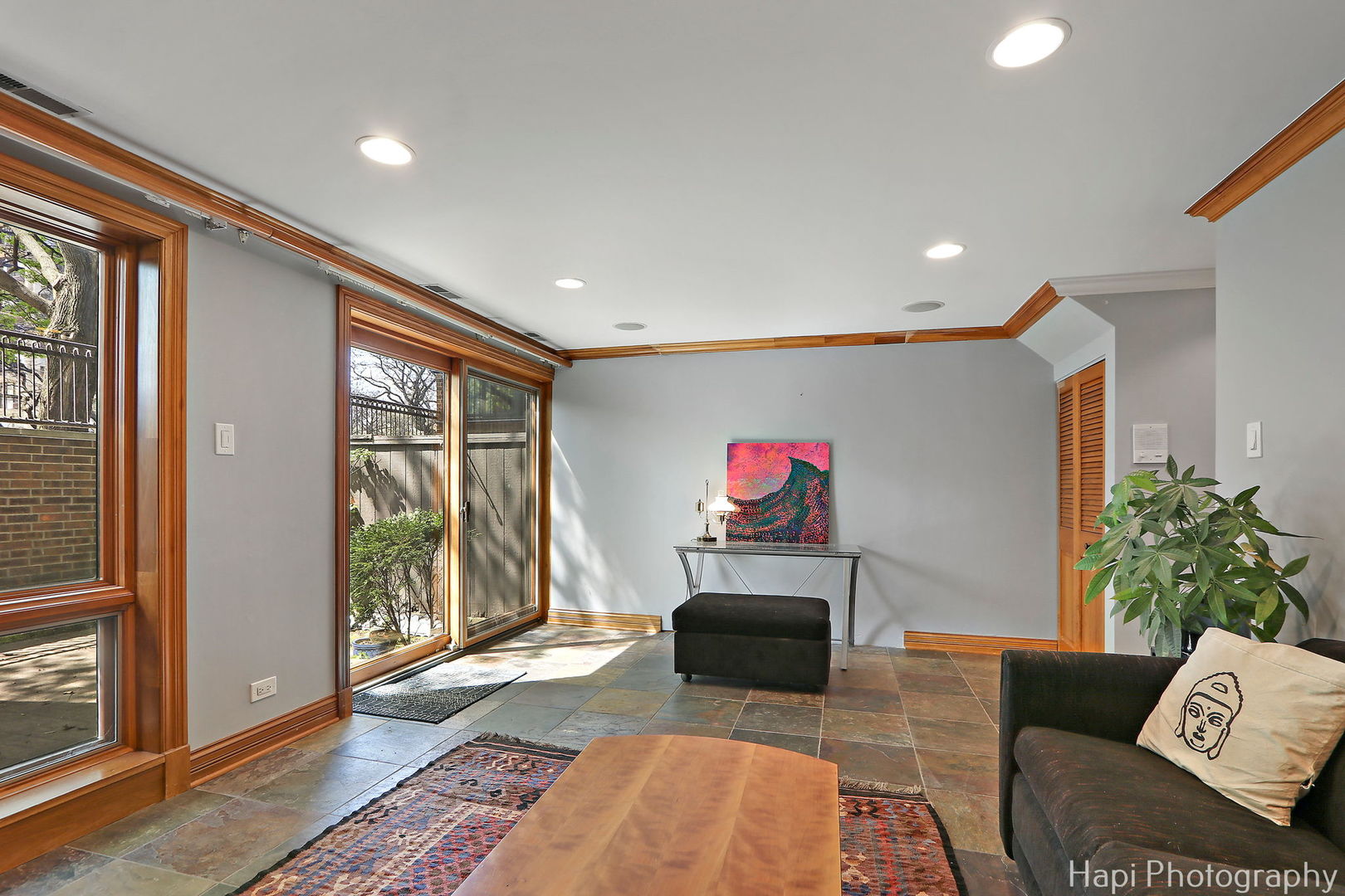 1340 North Sutton Place Chicago, IL 60610 - Photo 24 of 40 a living room with furniture and a potted plant