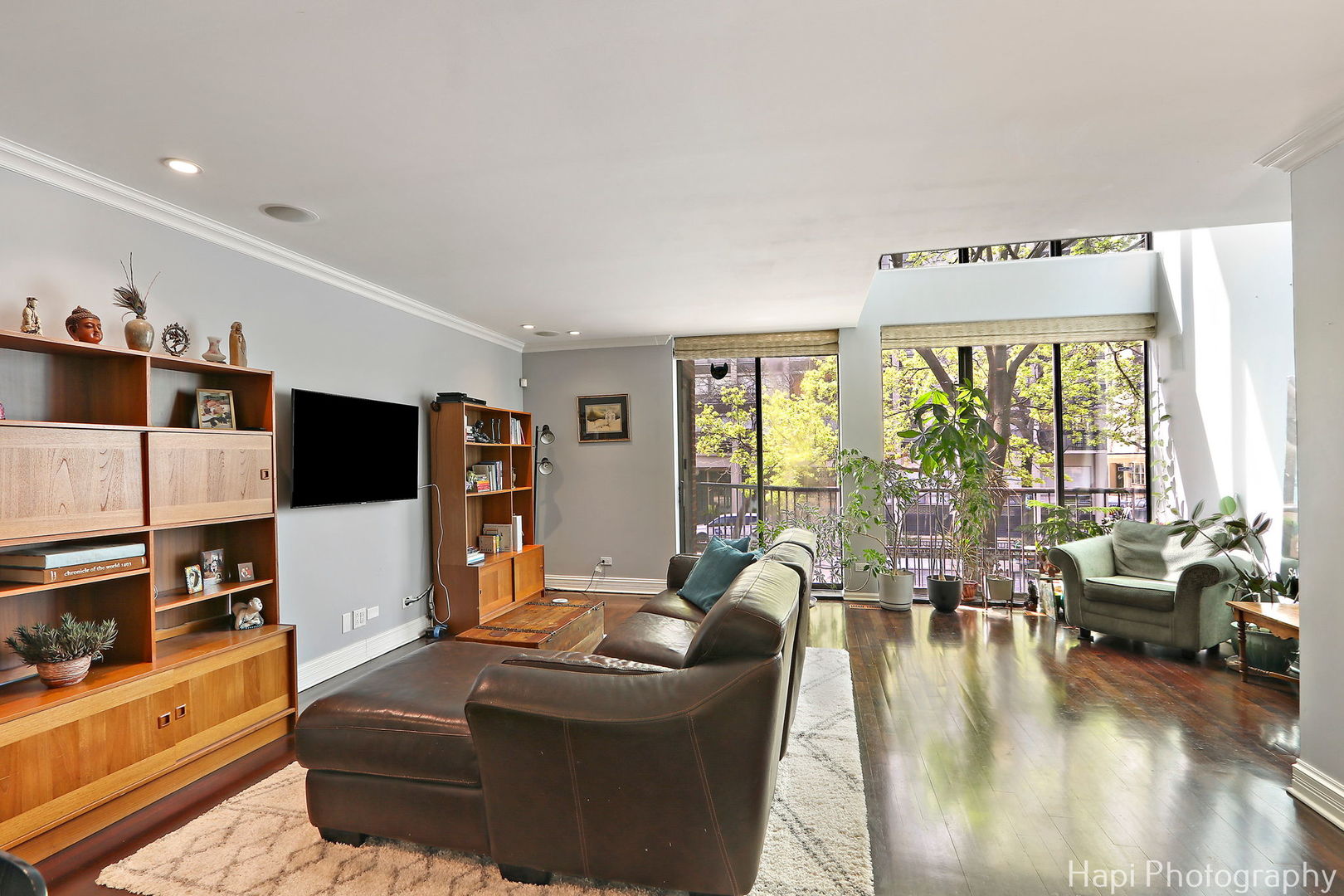 1340 North Sutton Place Chicago, IL 60610 - Photo 3 of 40 a living room with furniture and a flat screen tv