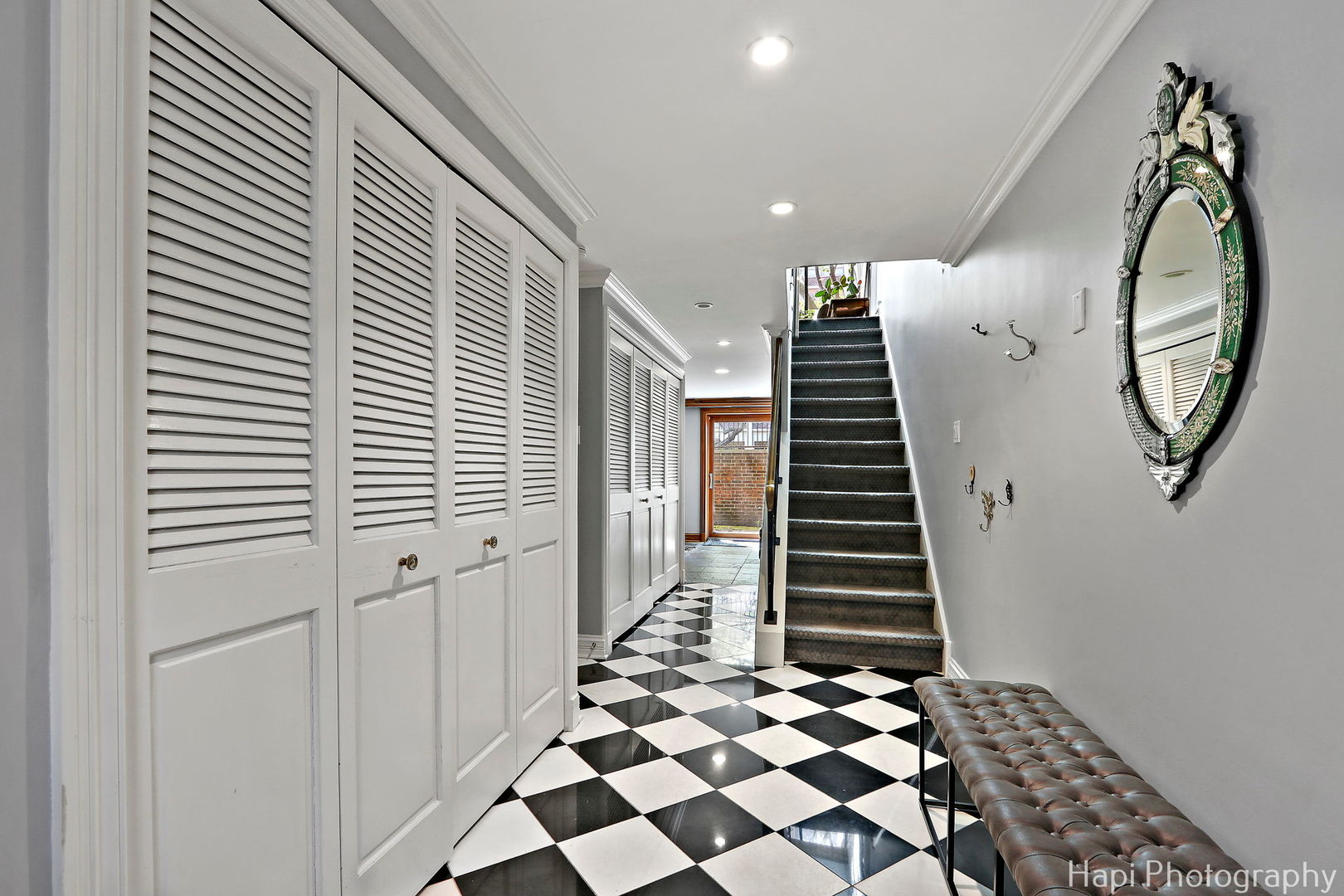1340 North Sutton Place Chicago, IL 60610 - Photo 33 of 40 a view of entryway with stairs and wooden floor