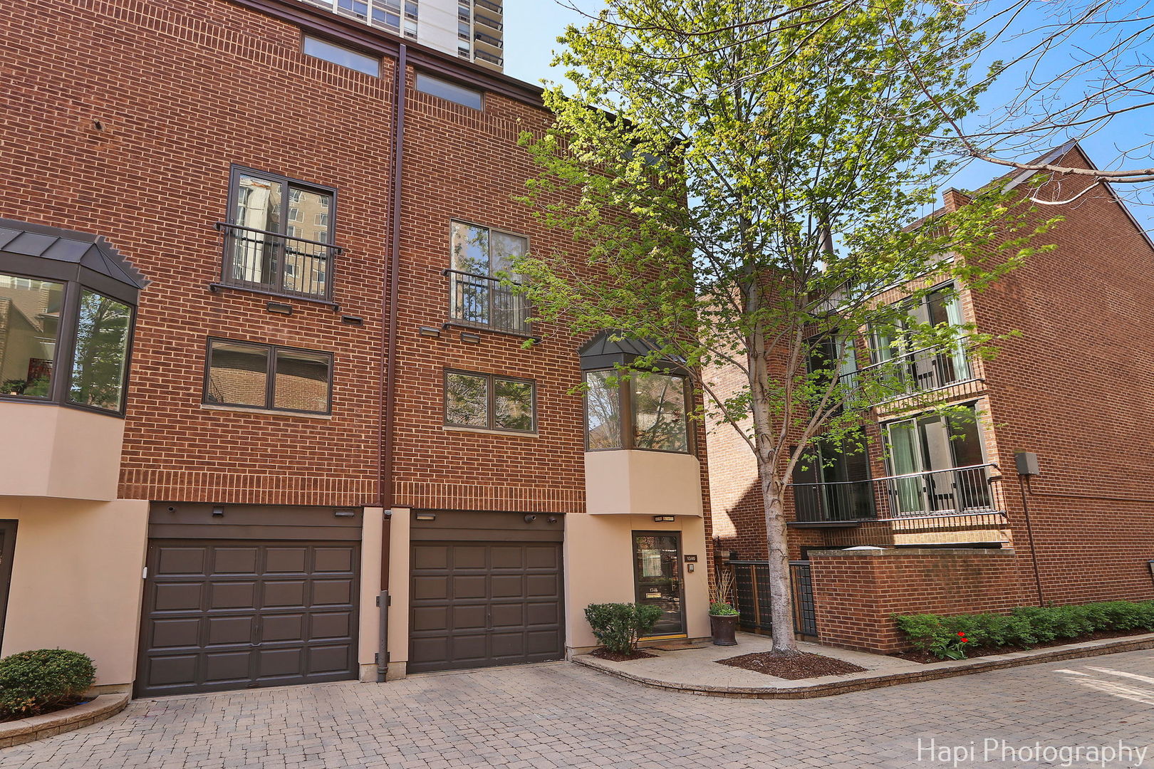 1340 North Sutton Place Chicago, IL 60610 - Photo 35 of 40 a front view of a house with a yard
