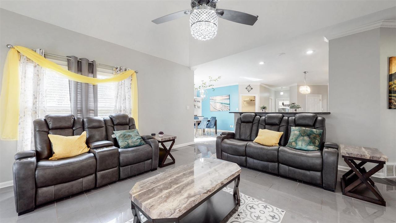 419 Military Road Collierville, TN 38017 - Photo 11 of 25 a living room with furniture wooden floor and a large window