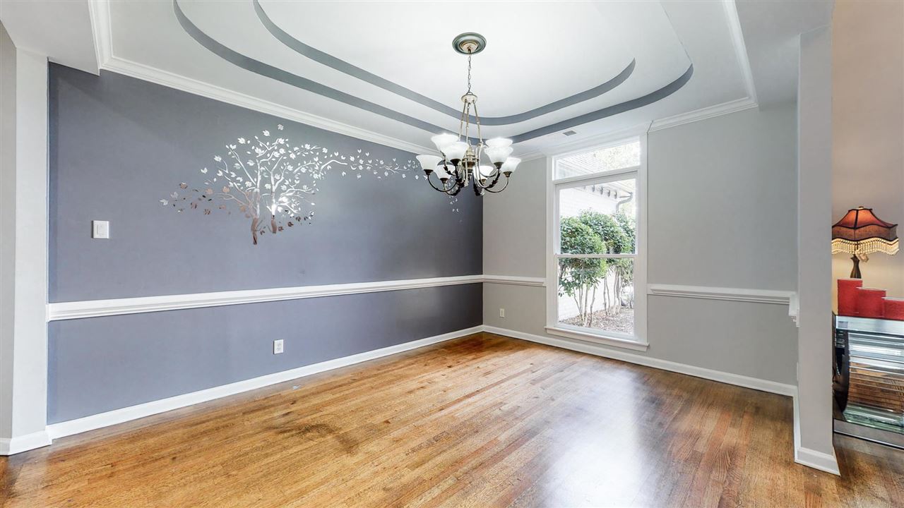 419 Military Road Collierville, TN 38017 - Photo 4 of 25 a view of a big room with wooden floor and chandelier