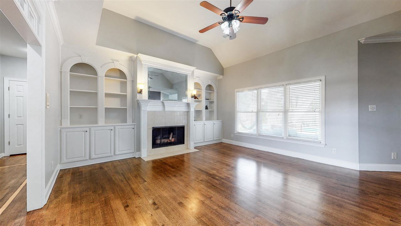 419 Military Road Collierville, TN 38017 - Photo 7 of 25 a view of a livingroom with a fireplace window and wooden floor