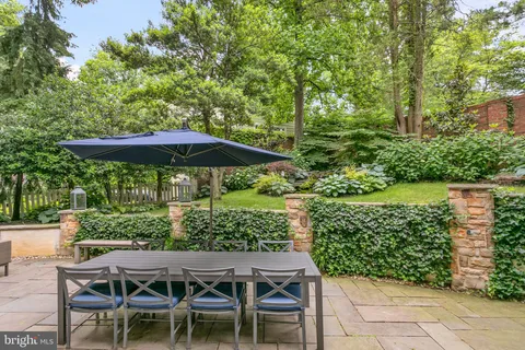 a patio with table and chairs