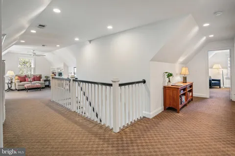 a view of a livingroom with furniture and a rug