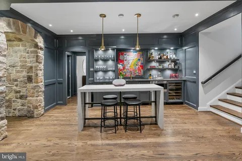 a dining room with furniture and a flat screen tv