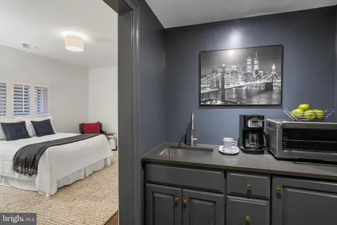 a bedroom with a bed and ceiling fan