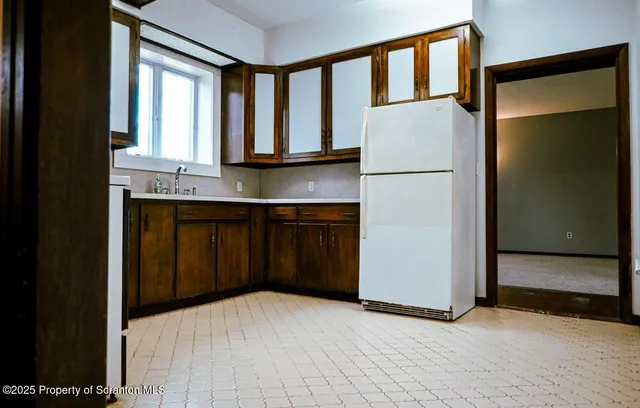 a kitchen with a sink and a window