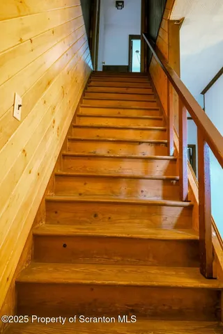 a view of an empty room with a closet