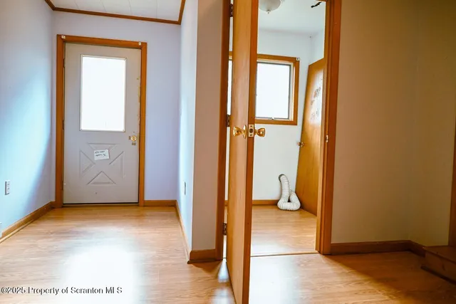 a view of gallery with wooden floor