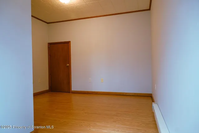 a bathroom with a toilet a sink and a window