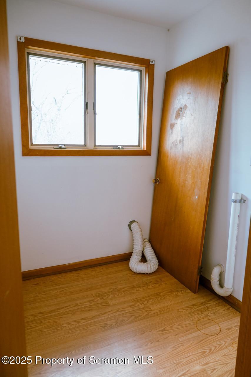 211 Wimmers Road Lake Ariel, PA 18436 - Photo 44 of 65 a view of a room with wooden floor and a window