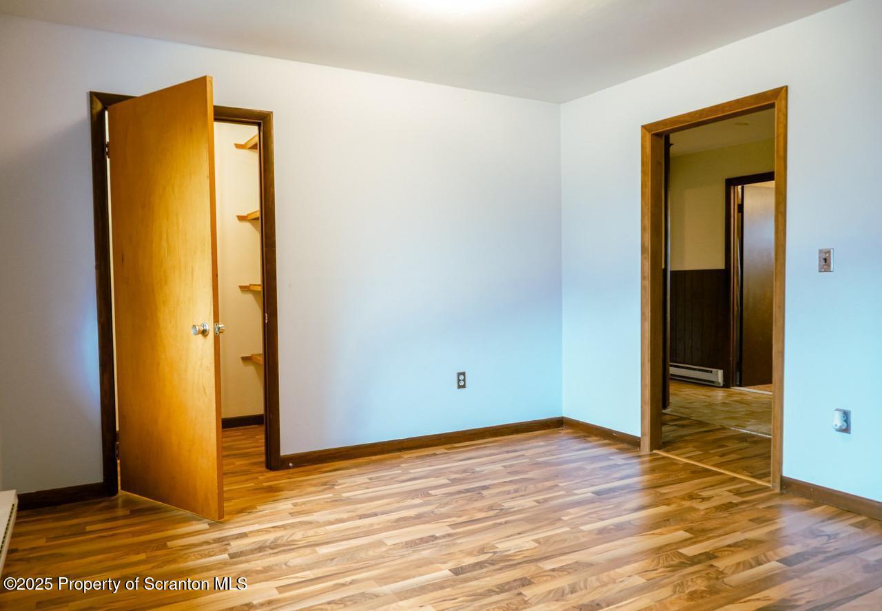 211 Wimmers Road Lake Ariel, PA 18436 - Photo 49 of 65 an empty room with wooden floor and a window