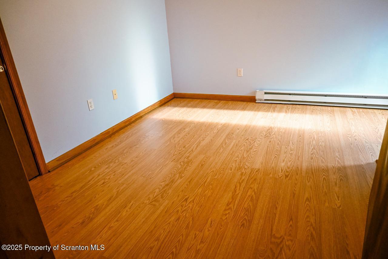 211 Wimmers Road Lake Ariel, PA 18436 - Photo 51 of 65 a view of empty room with wooden floor and fan