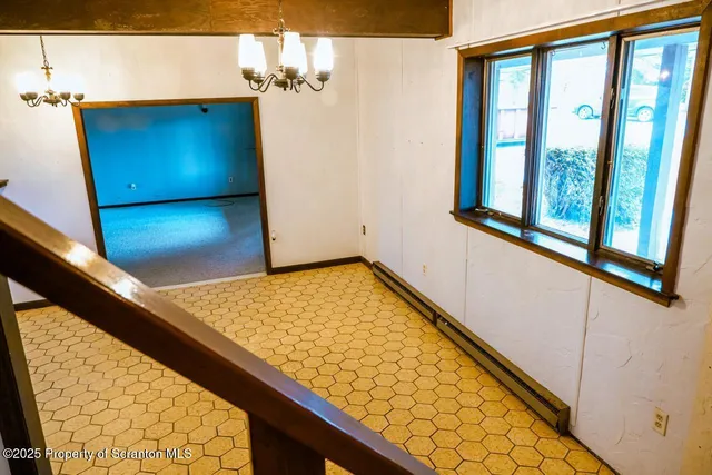 a kitchen with granite countertop a stove top oven microwave and cabinets