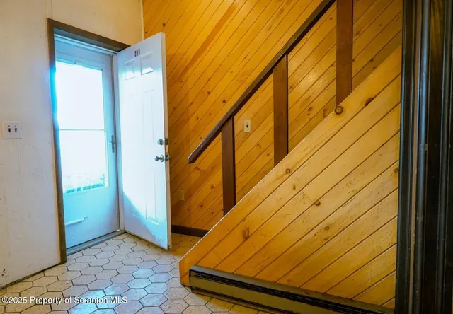 a kitchen with stainless steel appliances granite countertop a refrigerator a sink and dishwasher