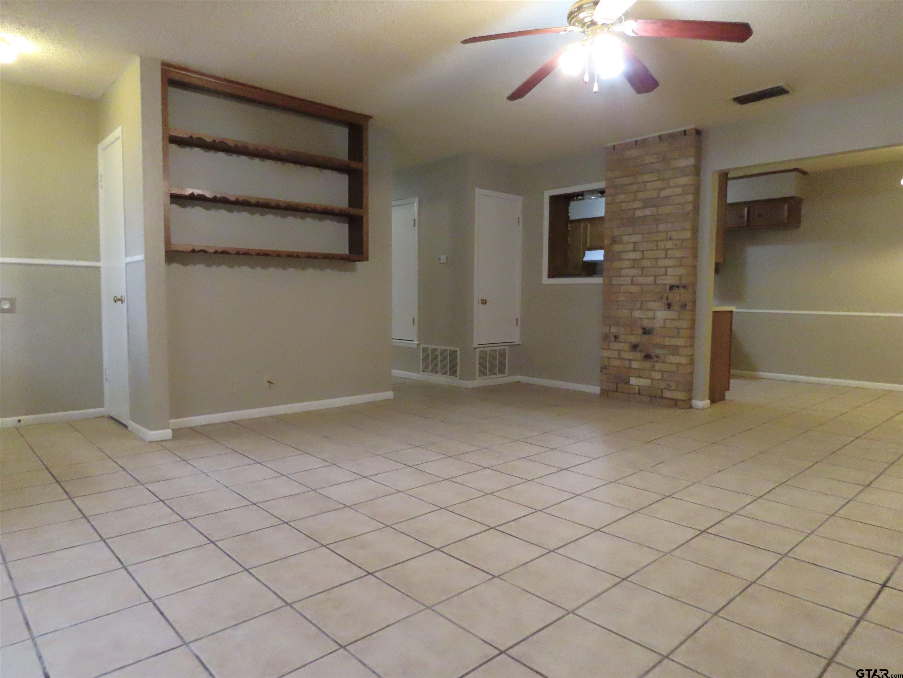 402 Muller Garden Road Tyler, TX 75703 - Photo 6 of 33 an empty room with windows