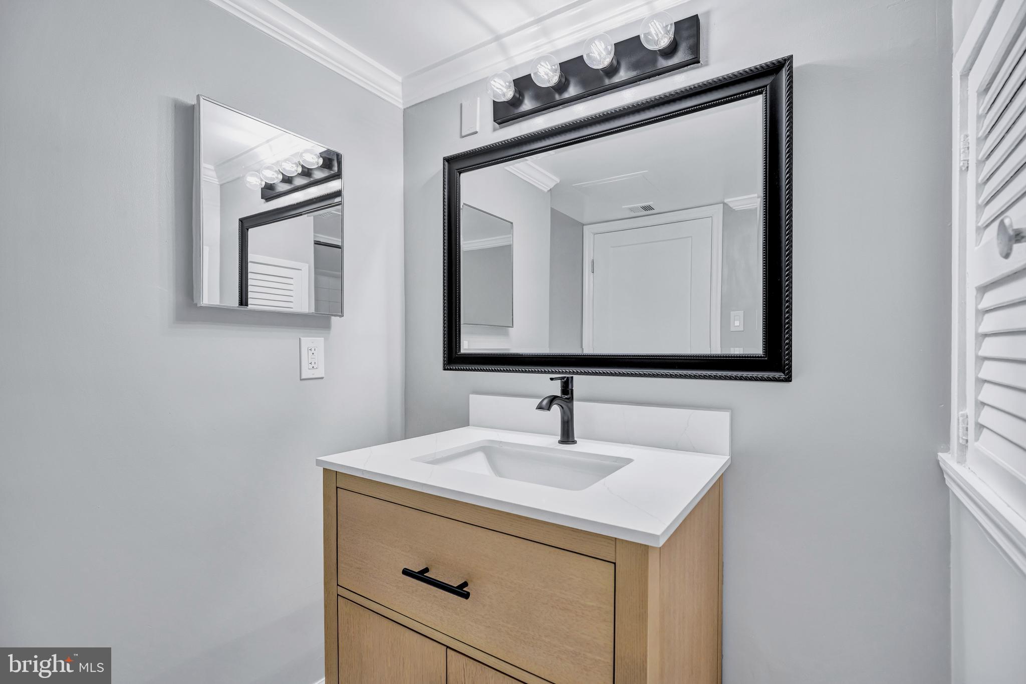 2605 Fort Farnsworth Road, Unit 314 Alexandria, VA 22303 - Photo 17 of 34 a bathroom with a sink vanity and a mirror