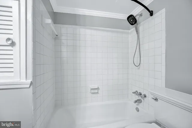 a bathroom with a shower and a bathtub