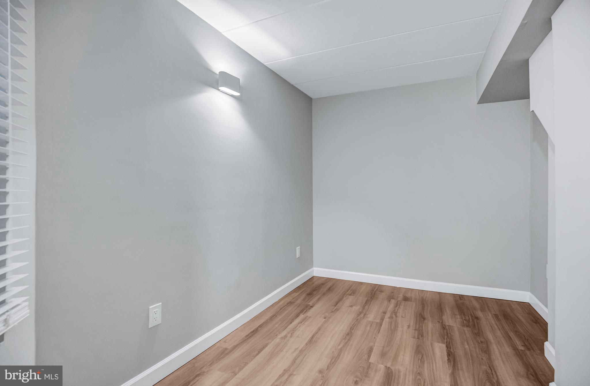 2605 Fort Farnsworth Road, Unit 314 Alexandria, VA 22303 - Photo 21 of 34 a view of room with window and wooden floor