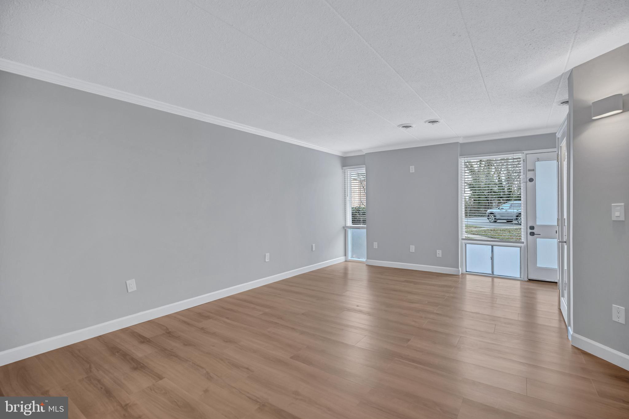 2605 Fort Farnsworth Road, Unit 314 Alexandria, VA 22303 - Photo 3 of 34 a view of a room with wooden floor