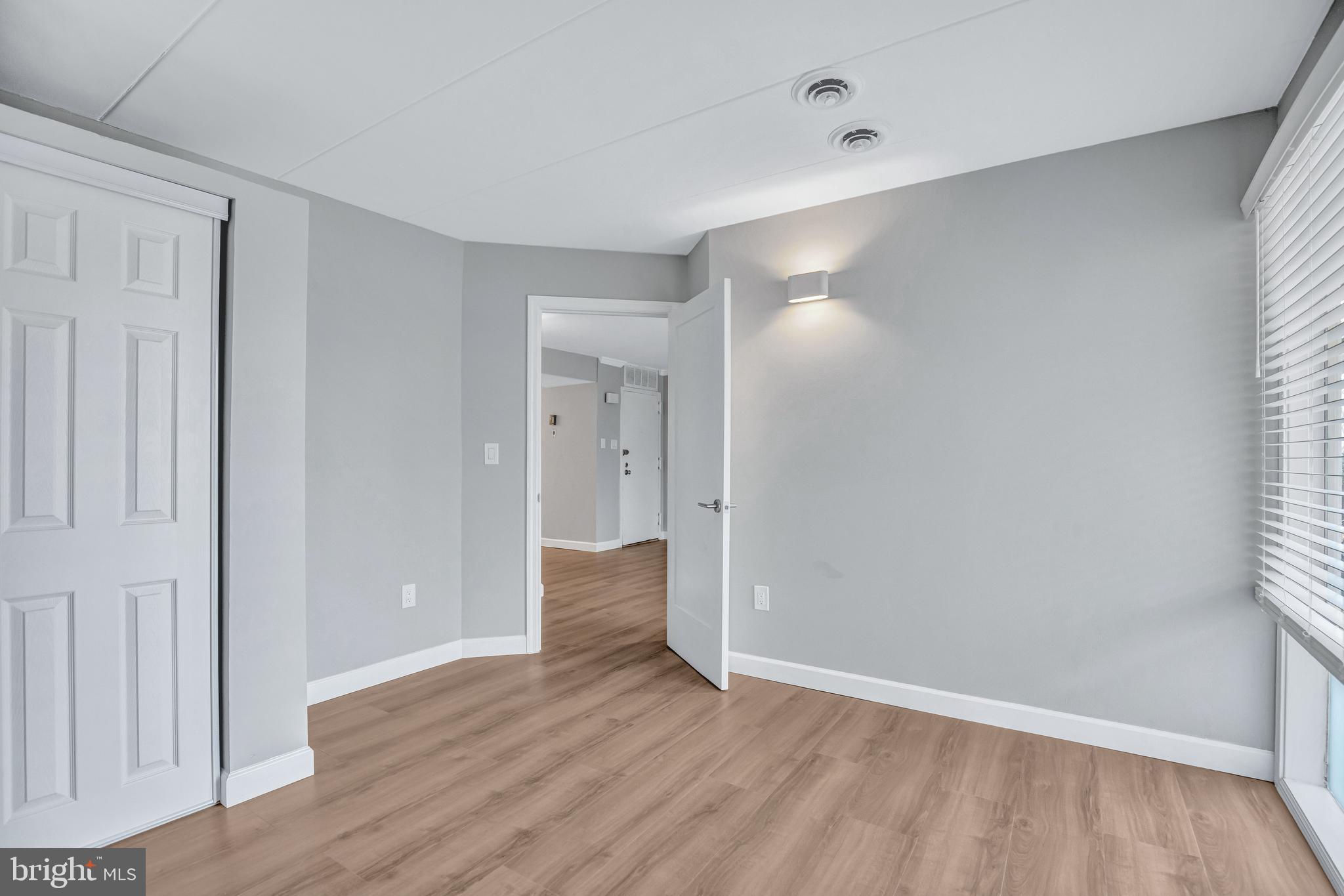 2605 Fort Farnsworth Road, Unit 314 Alexandria, VA 22303 - Photo 6 of 34 a view of an empty room with wooden floor